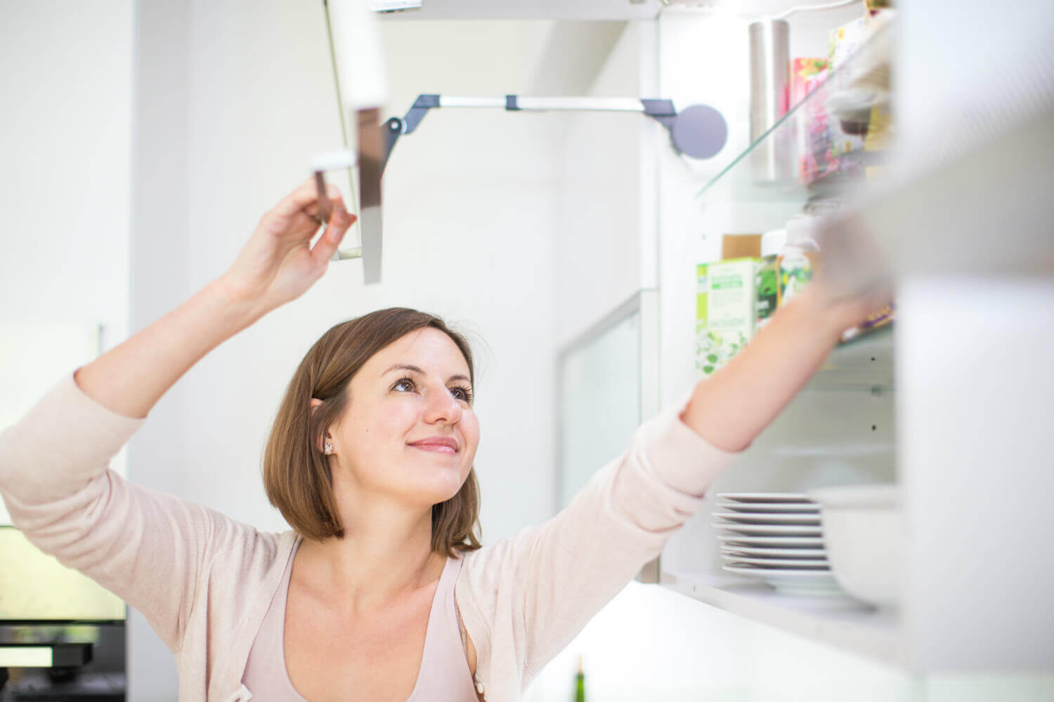 woman organizing kitchen